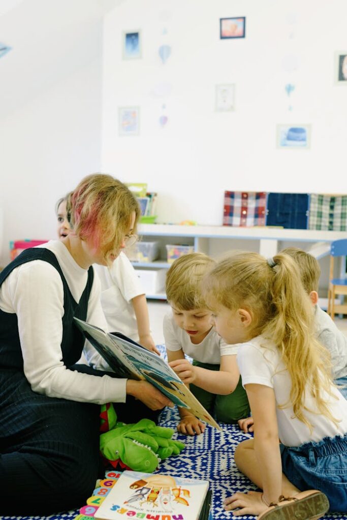 A teacher reading to an attentive group of children in a cozy classroom setting.